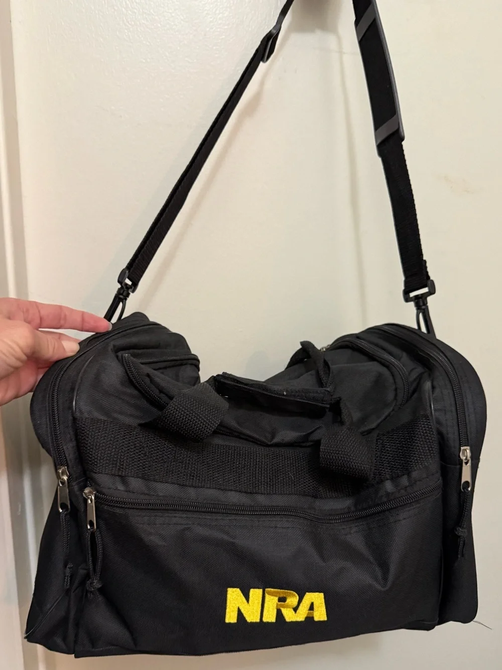 NRA Black Duffel Bag with Adjustable Shoulder Strap and Cotton Patches
